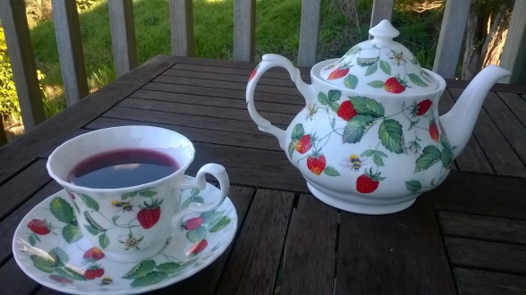 festive grape, herbal tea, herbal infusion, teacup and saucer, teapot, tea, dried apple, rosehip, hibiscus